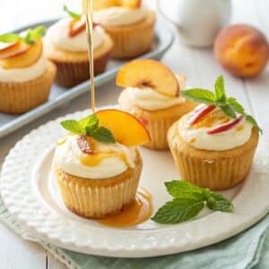 Honey peach cream cheese cupcakes served with mint