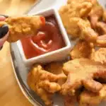 Crispy dino nuggets cooked in an air fryer, golden and delicious.