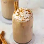 Delicious Pumpkin Spice Cold Brew topped with whipped cream and a sprinkle of cinnamon