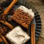 Delicious Apple Spice Cake with Buttercream Frosting topped with fresh apple slices.