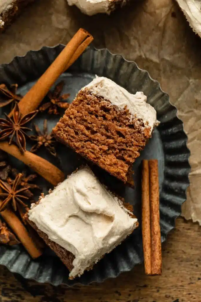 Delicious Apple Spice Cake with Buttercream Frosting topped with fresh apple slices.