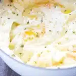 Creamy and fluffy BEST mashed potatoes served in a bowl.